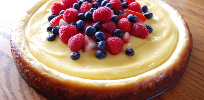 Lemon Cheesecake Topped with Lemon Curd and Fresh Berries